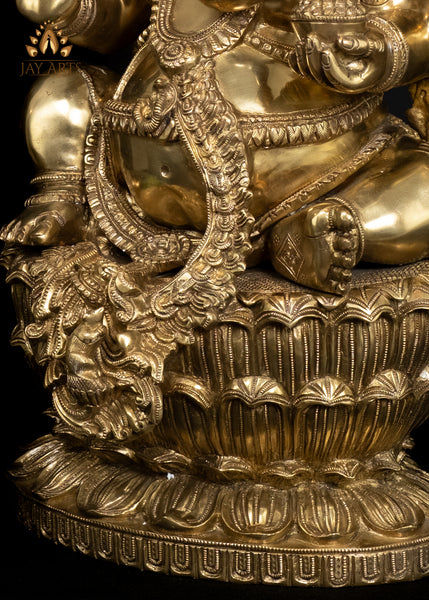 26" Brass Raja Ganapati seated on a Double Lotus Pedestal Wearing Elaborate Ornaments