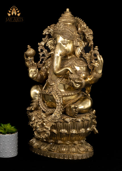 26" Brass Raja Ganapati seated on a Double Lotus Pedestal Wearing Elaborate Ornaments